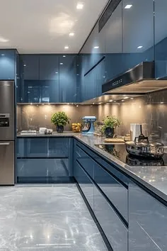 Glossy blue-grey kitchen with flat-panel cabinets, under-cabinet lighting, a stone-look backsplash and a gas cooktop.